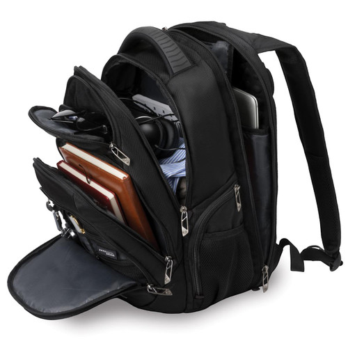 A black backpack with multiple compartments, holding a laptop, books, and various accessories inside.
