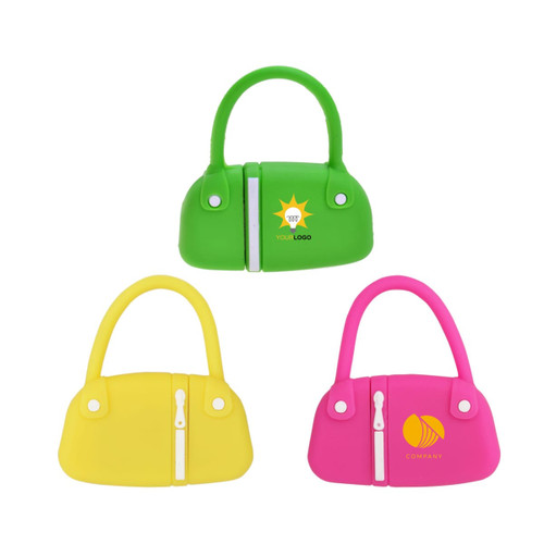 A set of three handbag-shaped flash drives in green, yellow, and pink, each featuring a logo.