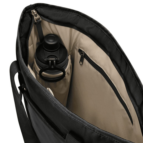 A black tote bag with a beige interior features a drink bottle in a side pocket and a zipped compartment.