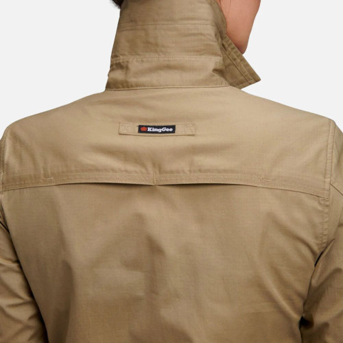 Detail of a khaki long-sleeve utility shirt showing three parted collar