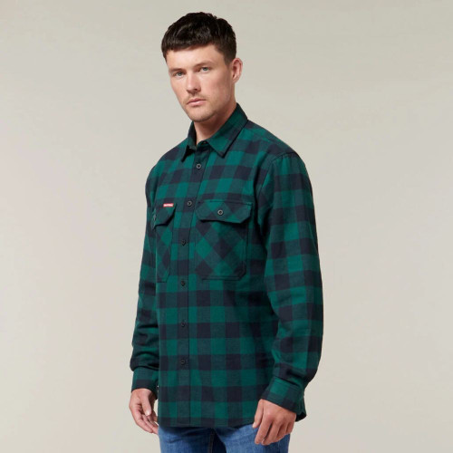 Man wearing green checkered flannel shirt.