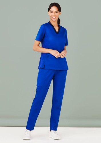 A pair of women's straight leg scrub pants in royal blue, featured with a matching scrub top and a logo.