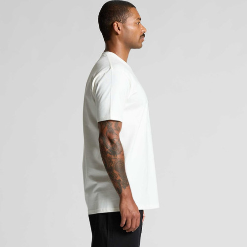 A white organic t-shirt displayed on a model, featuring a logo, with a side view showcasing its relaxed fit. A white organic t-shirt displayed on a model, featuring a logo, with a side view showcasing its relaxed fit.