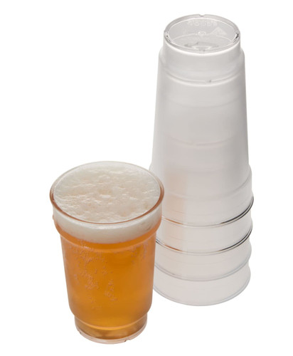 A 425ml plastic schooner glass in amber with a frothy drink, alongside a stack of transparent plastic cups.