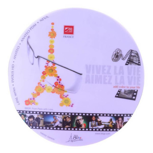 A round mouse mat featuring a floral design and the Eiffel Tower. It includes a logo and a film strip motif.