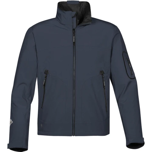 A men's softshell jacket in navy blue with a high collar and multiple zippered pockets. It features a logo on the sleeve.