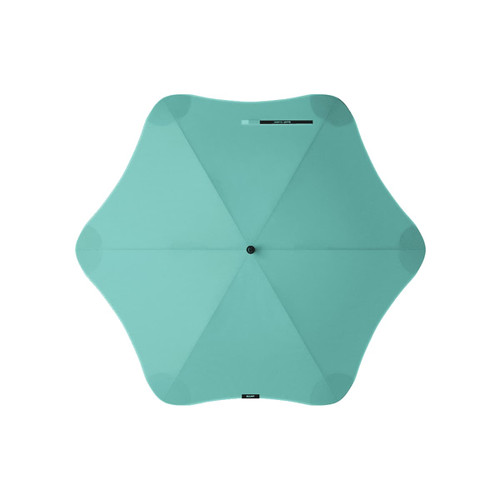 A mint green BLUNT Classic Umbrella with an octagonal shape and a central hub, featuring a logo.
