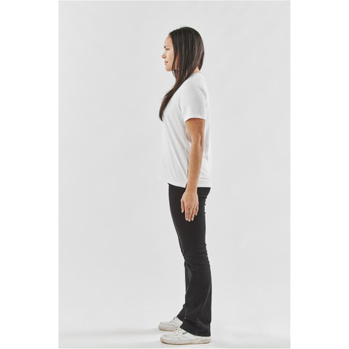 A white women's t-shirt displayed on a model standing in profile against a plain background.