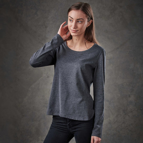 A long-sleeve women's tee in dark grey with a relaxed fit and crew neckline, featuring a logo on the garment.