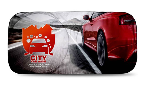 A full-colour sunshade featuring a red sports car on a winding road, with a logo and branding.