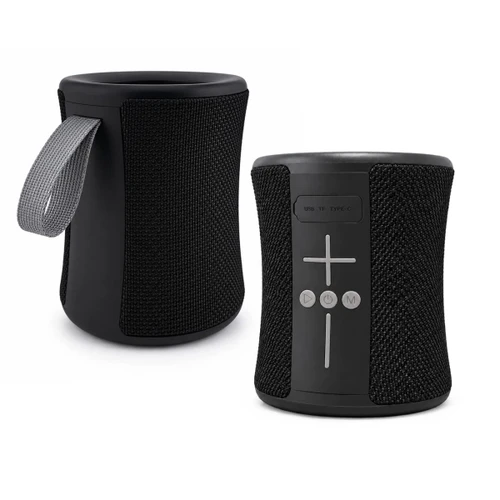 A compact black speaker with a textured exterior and a carrying strap, featuring control buttons on the front.
