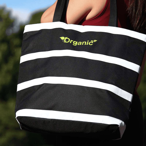 A striped black and white cooler bag with shoulder straps, featuring a logo on the front. A striped black and white cooler bag with shoulder straps, featuring a logo on the front.