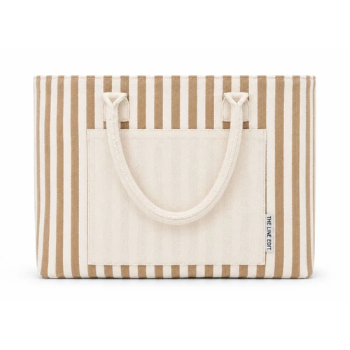 Folded beige and white striped Hampton tote bag featuring dual carry handles, a large front pocket, and a compact design for easy storage.