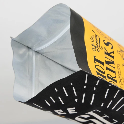 A large foil stand-up pouch with a black and yellow design and resealable top. Features a logo.