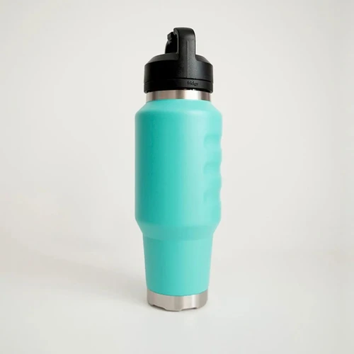 Side profile view of a turquoise insulated 1L water bottle showcasing textured grip indentations, a tapered cup-holder-friendly base, and a secure carry-handle lid.