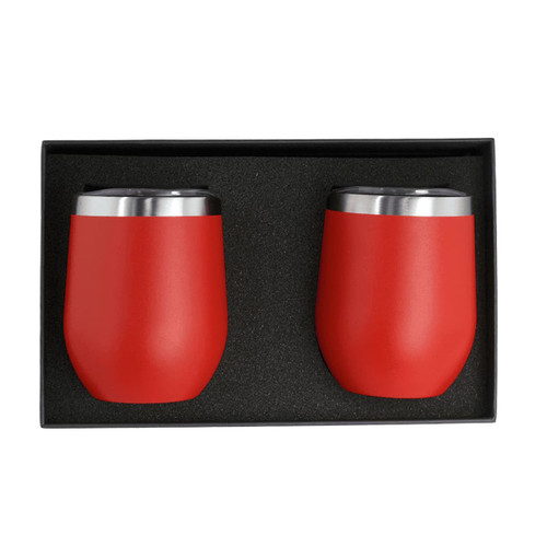 A set of two red insulated cups with stainless steel rims, displayed in a black gift box. A set of two red insulated cups with stainless steel rims, displayed in a black gift box.