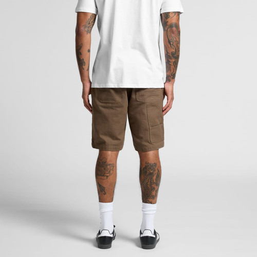 Canvas shorts in a light brown hue with cargo pockets, viewed from the back on a person wearing a white T-shirt. Canvas shorts in a light brown hue with cargo pockets, viewed from the back on a person wearing a white T-shirt.