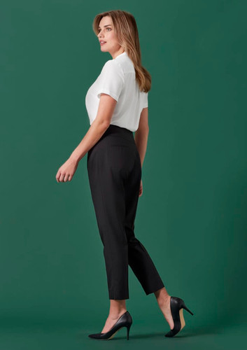 A woman models 7/8 mid-waist slim leg pants in black, paired with a white blouse and high heels. A woman models 7/8 mid-waist slim leg pants in black, paired with a white blouse and high heels.