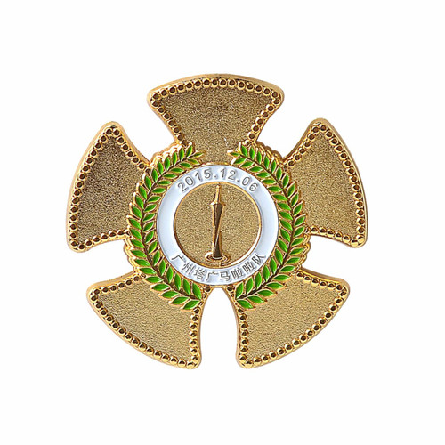 A gold cloisonné hard enamel pin shaped like a cross with a laurel wreath and a central medal. A gold cloisonné hard enamel pin shaped like a cross with a laurel wreath and a central medal.