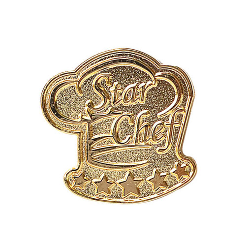A gold lapel pin shaped like a chef's hat with stars and the words "Star Chef". A gold lapel pin shaped like a chef's hat with stars and the words "Star Chef".