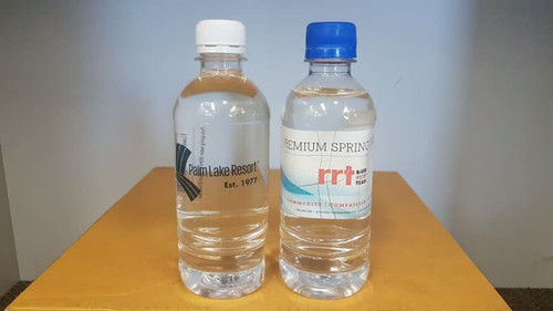 A drink bottle set featuring two clear 350ml bottles, one with a white cap and the other with a blue cap. Both have labels. A drink bottle set featuring two clear 350ml bottles, one with a white cap and the other with a blue cap. Both have labels.