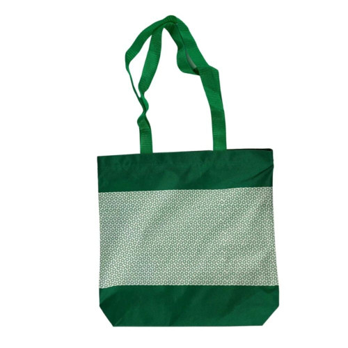 Green and white patterned tote bag with long handles.