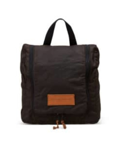 A dark brown toiletry bag with a textured exterior, featuring a top handle and a zip closure. It has a logo patch. A dark brown toiletry bag with a textured exterior, featuring a top handle and a zip closure. It has a logo patch.