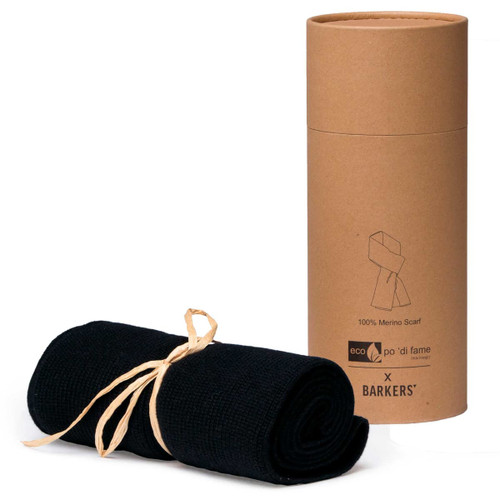A black 100% Merino scarf, neatly rolled and tied with twine, displayed alongside a cylindrical cardboard packaging with branding. A black 100% Merino scarf, neatly rolled and tied with twine, displayed alongside a cylindrical cardboard packaging with branding.