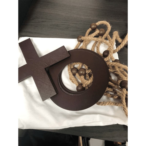 A wooden Trekk Tic Tac Toe game with brown pieces and a canvas bag, featuring a rope for storage. A wooden Trekk Tic Tac Toe game with brown pieces and a canvas bag, featuring a rope for storage.