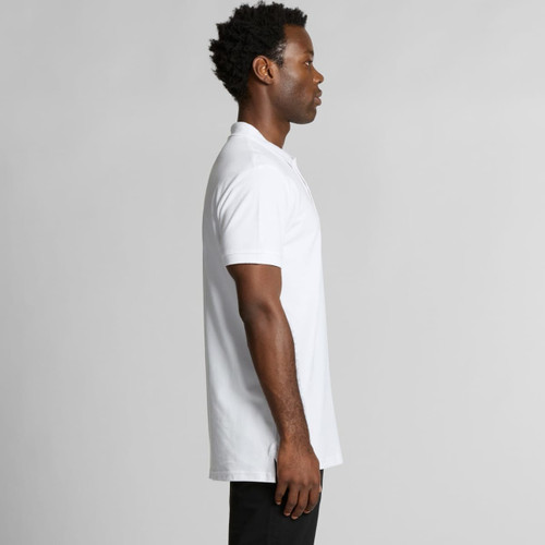 A white polo shirt displayed on a model from the side, featuring a logo on the chest. A white polo shirt displayed on a model from the side, featuring a logo on the chest.