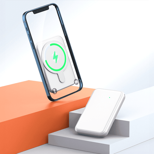 A white magnetic power bank positioned next to a smartphone, showcasing its charging capability. A white magnetic power bank positioned next to a smartphone, showcasing its charging capability.