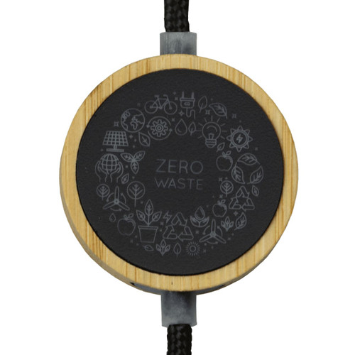 A black and bamboo circular adaptor featuring a "Zero Waste" design, attached to a braided cable. A black and bamboo circular adaptor featuring a "Zero Waste" design, attached to a braided cable.