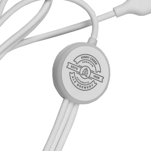 A white 6-in-1 charging cable with a circular branding logo, showcasing multiple connector options. A white 6-in-1 charging cable with a circular branding logo, showcasing multiple connector options.