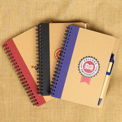 Three spiral-bound notebooks in brown, red, and blue, with a ballpoint pen attached. Each has a logo. Three spiral-bound notebooks in brown, red, and blue, with a ballpoint pen attached. Each has a logo.