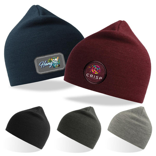 Two beanies in navy and burgundy with badges, alongside black, olive, and grey beanies stacked below. Two beanies in navy and burgundy with badges, alongside black, olive, and grey beanies stacked below.