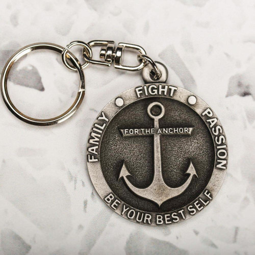 Anchor-themed keychain with motivational words engraved on metal.