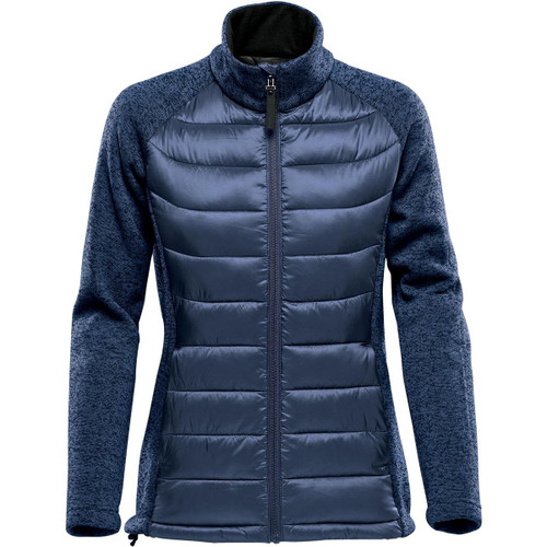 A women's hybrid jacket in navy blue with a mix of padded and soft fabric textures, featuring a high collar and zip closure. A women's hybrid jacket in navy blue with a mix of padded and soft fabric textures, featuring a high collar and zip closure.