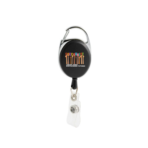 A black retractable ID badge holder with a clip and a clear badge attachment. It features a logo. A black retractable ID badge holder with a clip and a clear badge attachment. It features a logo.