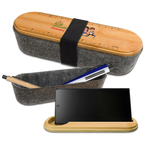 A gray felt utility case with a bamboo lid featuring a ruler, alongside a pen and a smartphone. A gray felt utility case with a bamboo lid featuring a ruler, alongside a pen and a smartphone.