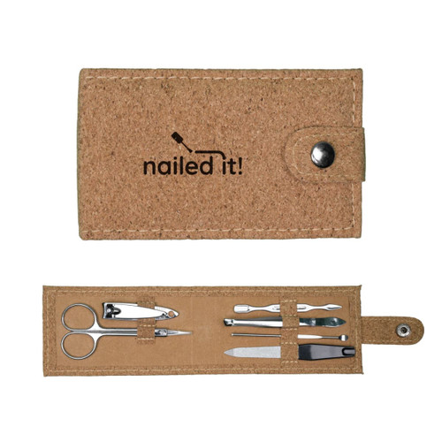 A cork manicure set featuring scissors, nail clippers, tweezers, nail files, and a snap closure. A cork manicure set featuring scissors, nail clippers, tweezers, nail files, and a snap closure.