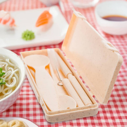 A beige ramen cutlery set in a compact case, featuring a spoon, fork, knife, and chopsticks.