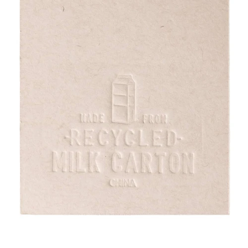 A booklet made from recycled milk cartons, featuring an embossed design that highlights its eco-friendly material.