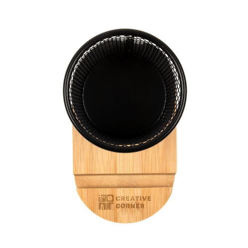 A black wire mesh pen tidy with a bamboo base. The base features a logo. A black wire mesh pen tidy with a bamboo base. The base features a logo.