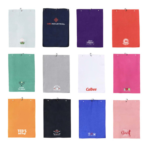 A collection of various golf towels in multiple colours, featuring different designs and logos, arranged in a grid. A collection of various golf towels in multiple colours, featuring different designs and logos, arranged in a grid.