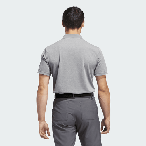 A grey polo shirt displayed from the back, featuring a collar and short sleeves. The shirt has a branding logo.