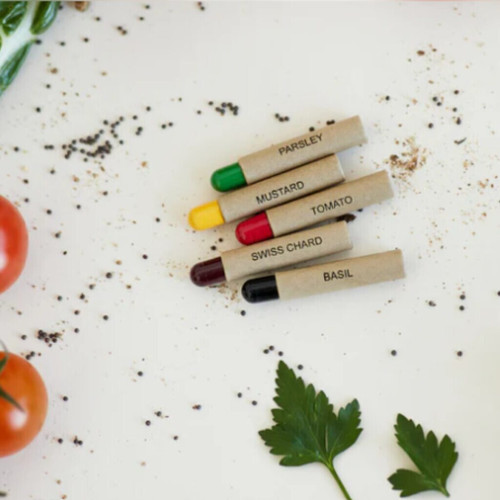 Herb plant markers for parsley, mustard, tomato, Swiss chard, basil with tomatoes and parsley leaves.