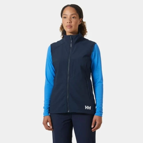 Front view of a navy Helly Hansen women's softshell vest featuring a full-length zipper, stand collar, zippered pockets, and a streamlined athletic fit.