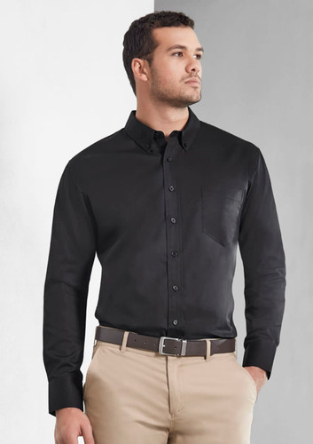 A men's long sleeve shirt in black, featuring a button-down front and a chest pocket. Includes a logo. A men's long sleeve shirt in black, featuring a button-down front and a chest pocket. Includes a logo.