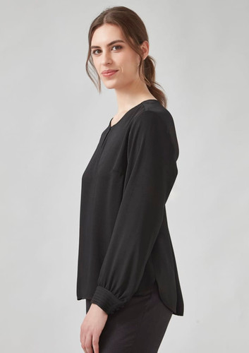 A black long sleeve blouse with a loose fit and gathered sleeves, featuring a round neckline and a subtle side split. A black long sleeve blouse with a loose fit and gathered sleeves, featuring a round neckline and a subtle side split.