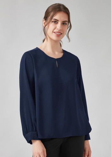A navy long sleeve blouse featuring a round neckline and subtle detailing at the cuffs, with a branding logo. A navy long sleeve blouse featuring a round neckline and subtle detailing at the cuffs, with a branding logo.